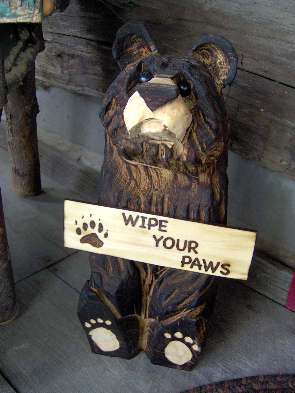 chainsaw carved bear wipe your paws