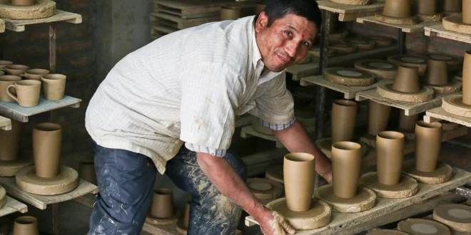 Krishna-Bahadur-Prajapati-crafts-the-pottery-with-the-wheel-at-Everest-Pottery-11-660x330.jpg