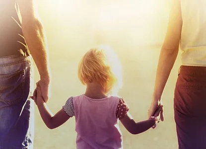 into-the-light--parents-hold-hands-with-small-child.jpg