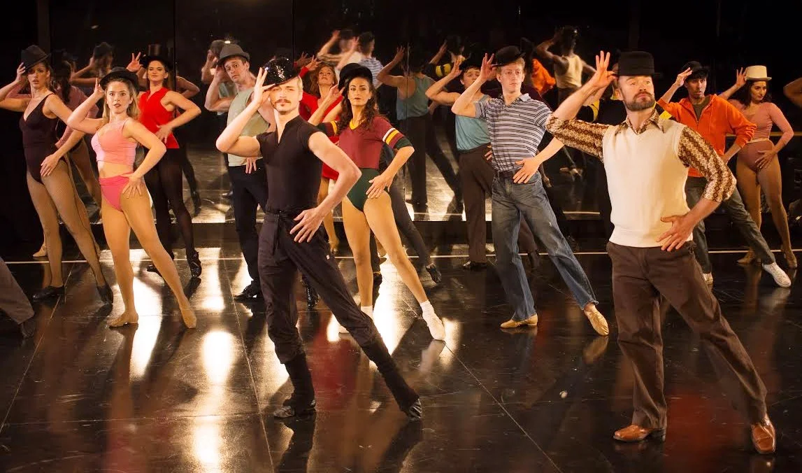 Zach (Eric S. Robertson, in white vest) with assistant Larry (Spencer Pond), and the cast of A Chorus Line (photo: Rich Wagner)