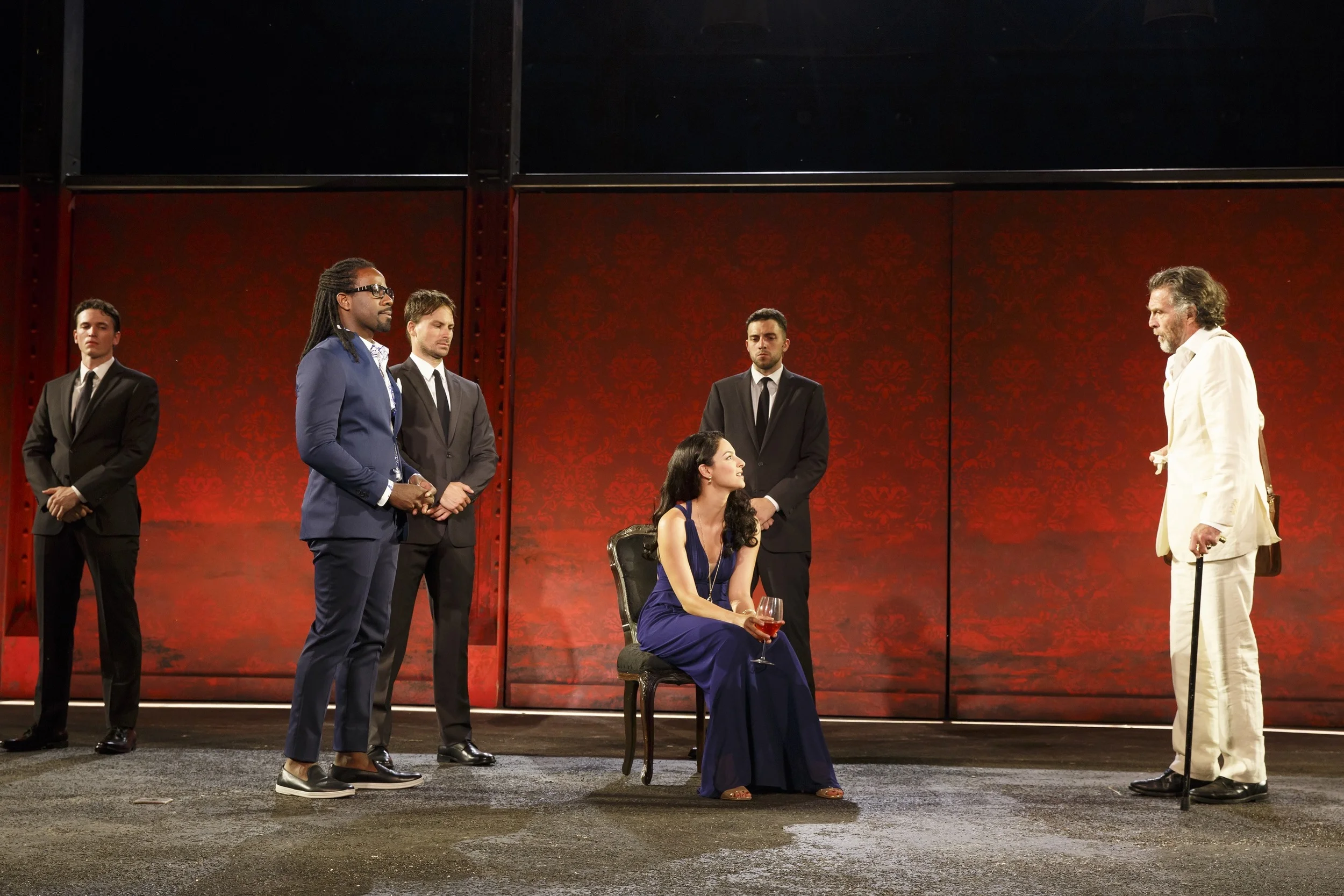 Court gossip: foreground: Paris (Maurice Jones), Helen (Tala Ashe), Pandarus (John Glover)