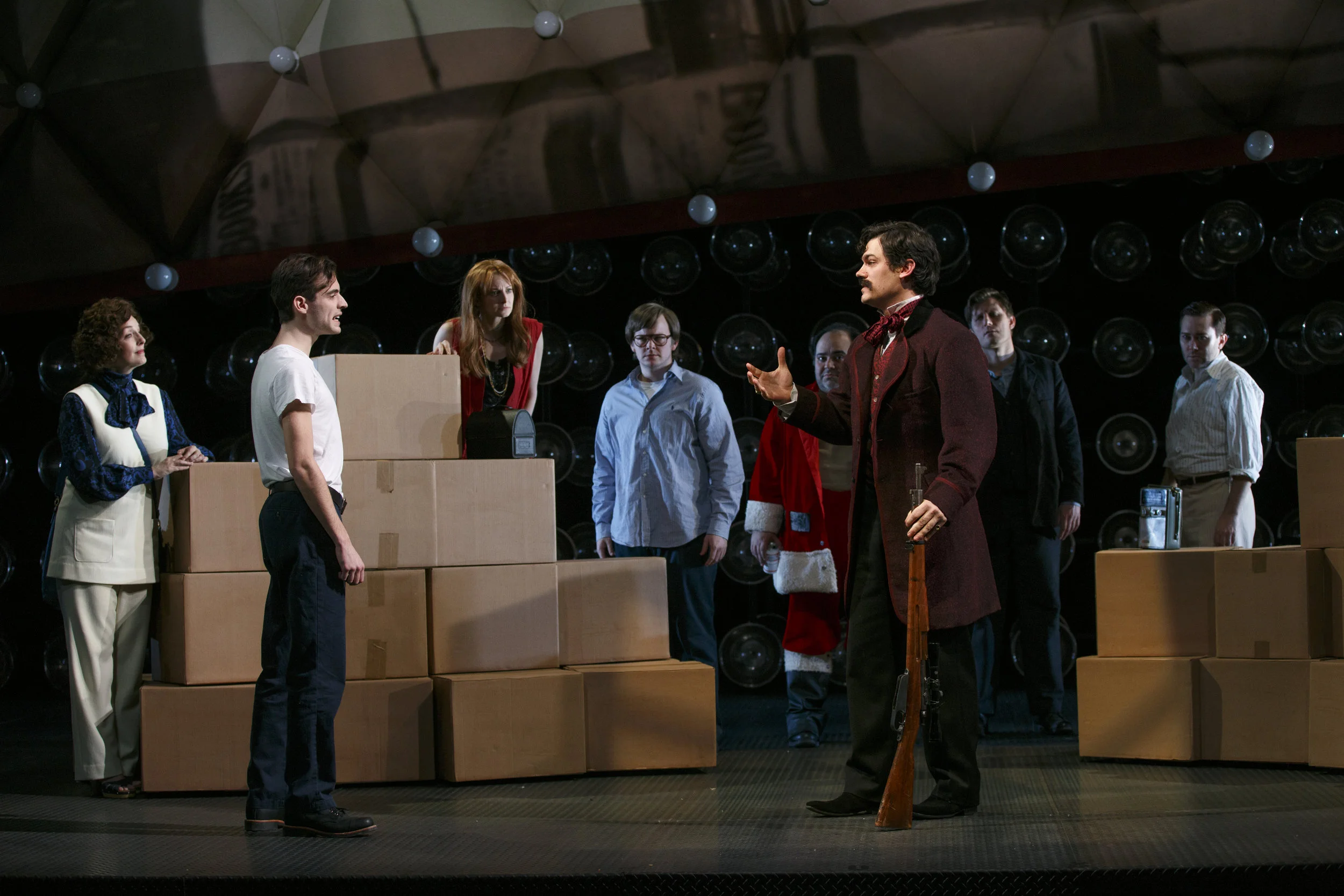 front: Lee Harvey Oswald (Dylan Frederick), John Wilkes Booth (Robert Lenzi) and the cast of Assassins (photo: Carol Rosegg)