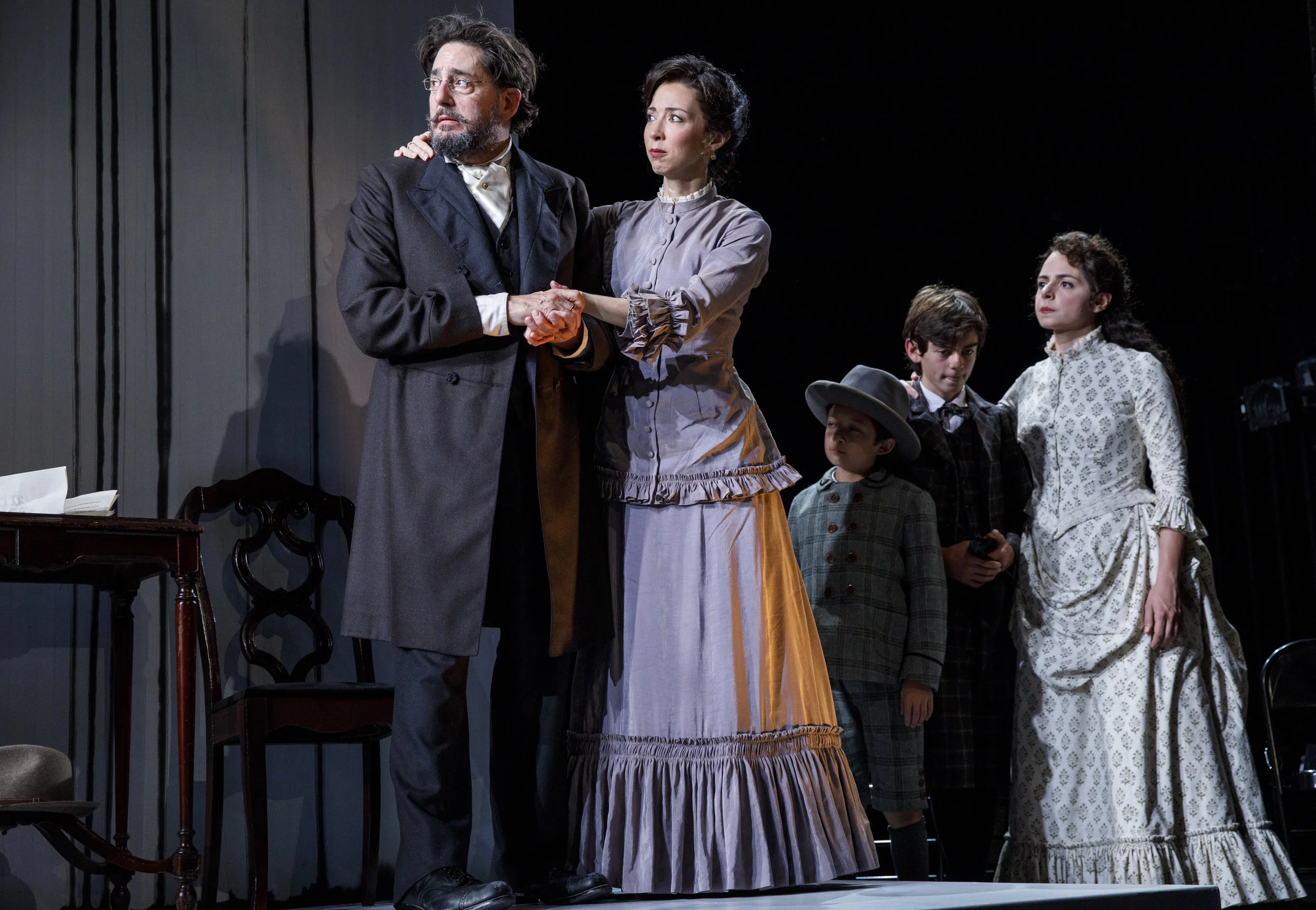 Dr. Stockmann (Reg Rogers), Mrs. Stockmann (Joey Parsons), and their children (James Jisoo Maroney, Atticus Burrello, Stephanie Machado) (photos by Joan Marcus)