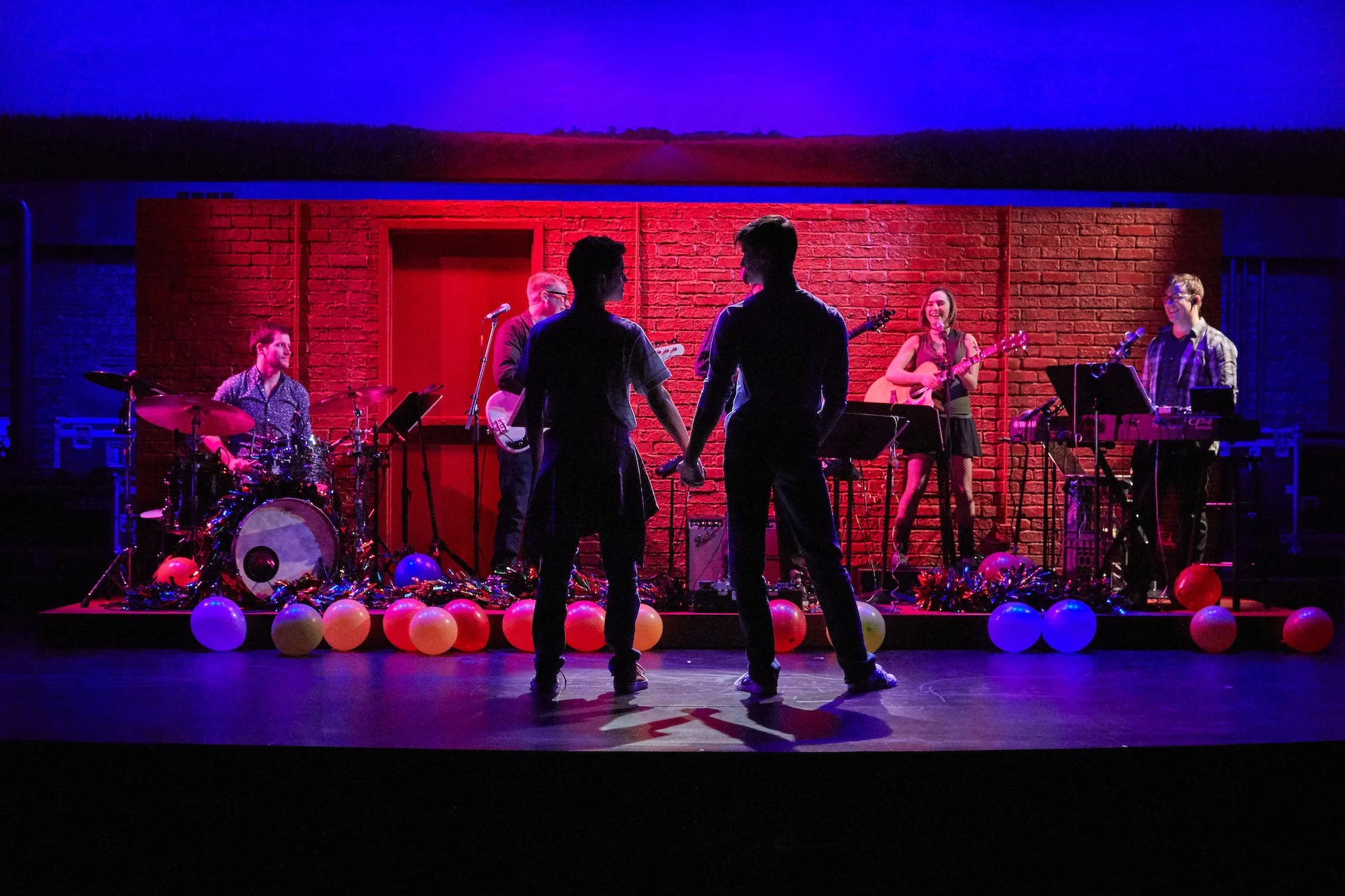 Will (David Merino), Mike (CJ Pawlikowski) and the band in Girlfriends, directed by Rob Ruggiero, at TheaterWorks, photos courtesy of TheaterWorks