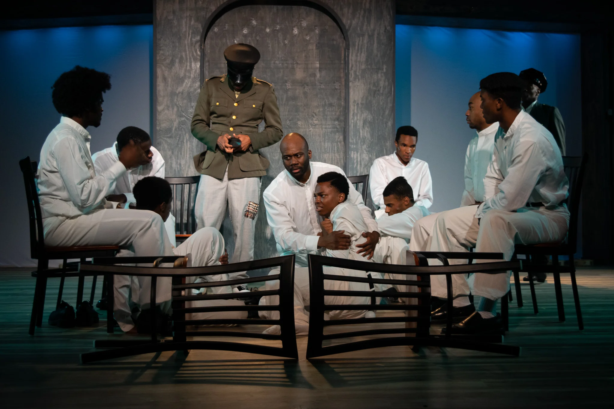Center, seated: Heywood Patterson (Troy Valjean Rucker) and Eugene Williams (Trishawn Paul) with the cast of The Scottsboro Boys