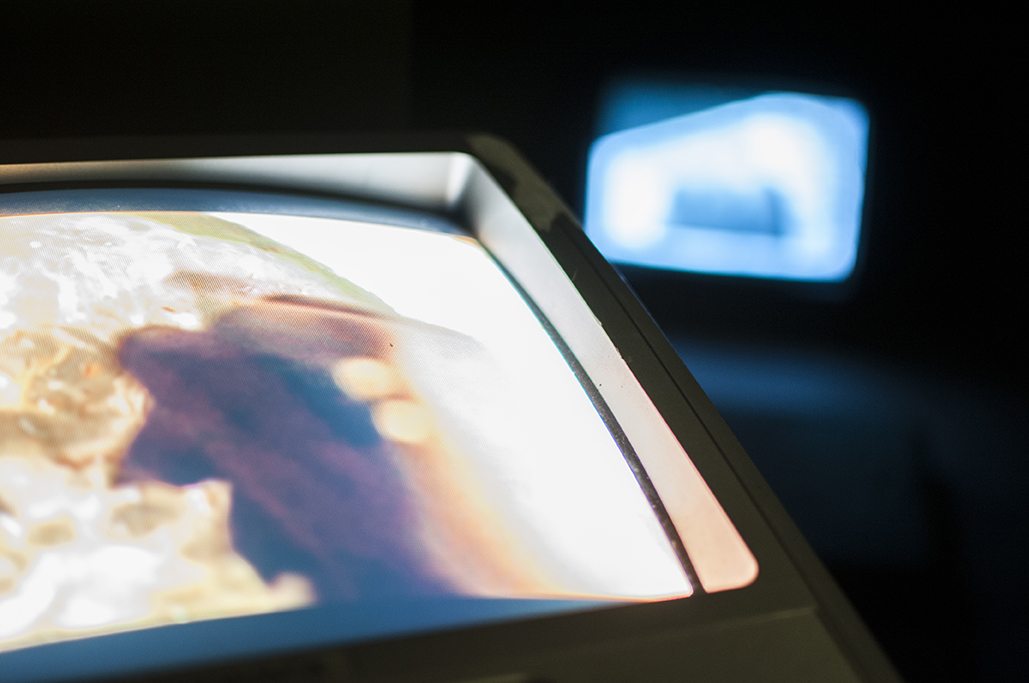 Hyphen (self-portrait) Multimedia installation: projection, sound, television, DVDs in a constructed room 96x125x96 inches. Installation view.