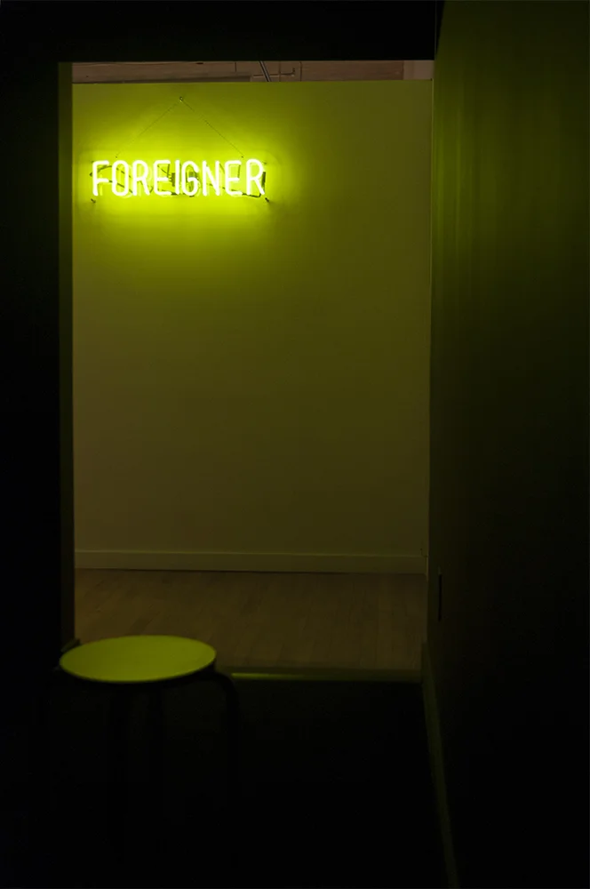 are you listening to me? Multimedia installation: FOREIGNER neon sign, projector, and black box. Installation view. 