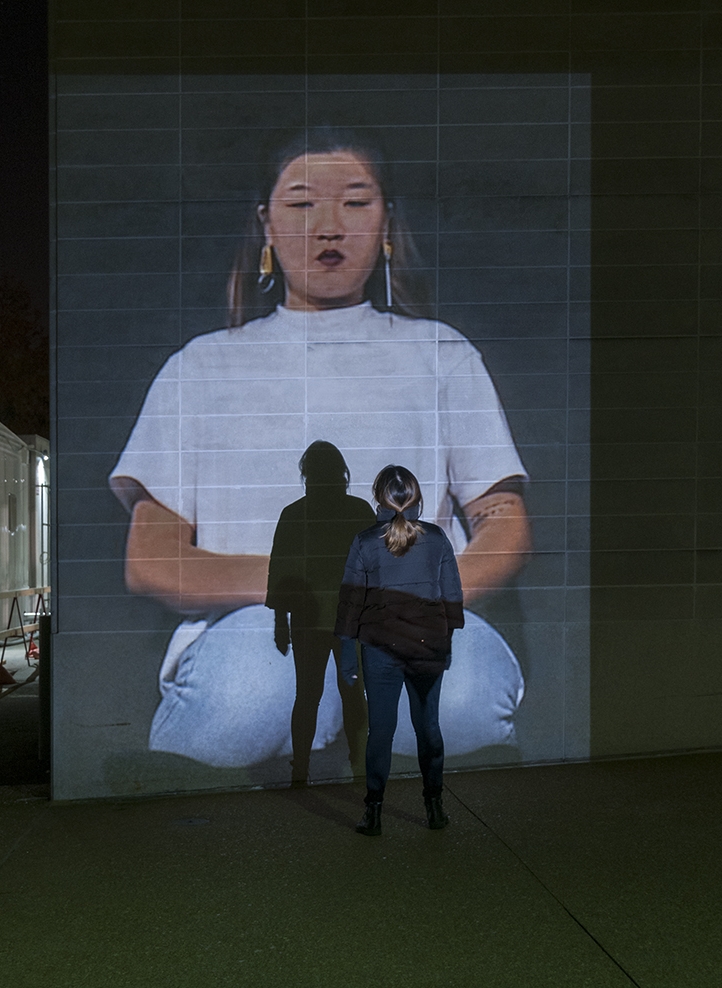I Am Kneeling. Public art installation of a 132 x 96 inch projection on the facade of Walker Hall at Washington University at St. Louis. Installation view. 