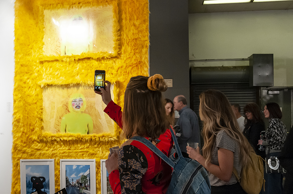I DARE YOU TO BUY ME I & I DARE YOU TO BUY ME II Photography Installation: Archival prints, yellow shag fur frame, yellow shag fur. 2019 LA Art Show Installation View.
