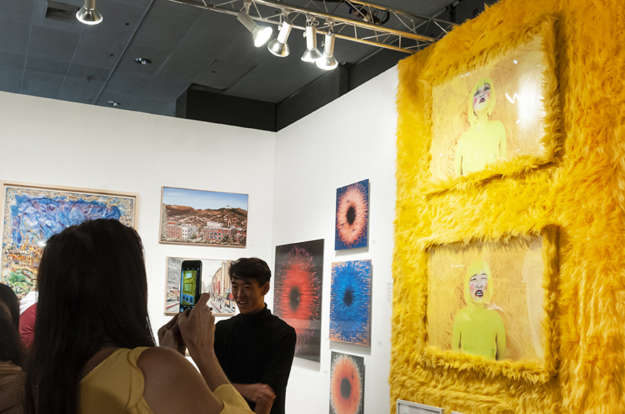 I DARE YOU TO BUY ME I & I DARE YOU TO BUY ME II Photography Installation: Archival prints, yellow shag fur frame, yellow shag fur. 2019 LA Art Show Installation View.