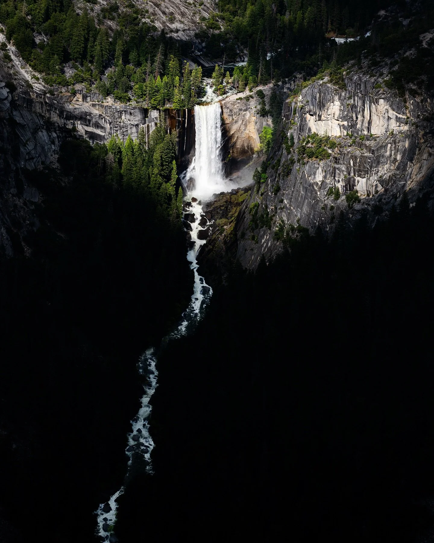 The Vein of Vernal.
One of my favorites from our recent trip. A keen eye will spot hikers on the Mist Trail while others pause at the top of the falls. I especially love the white water of the river cutting through the shadows as it roars into the v