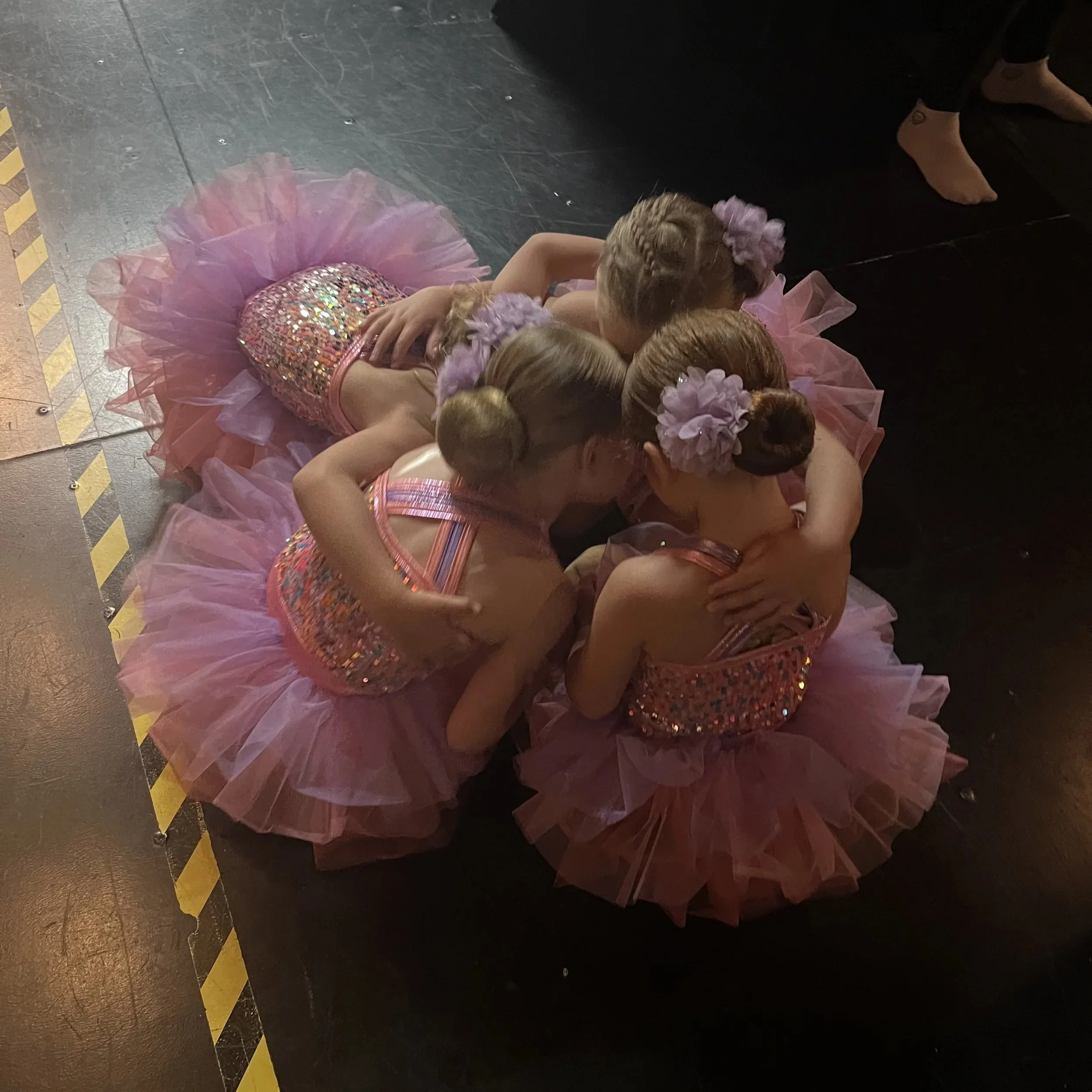 Dancers supporting each other backstage at Recital 2026 ©Step N’ Time Dance Studio