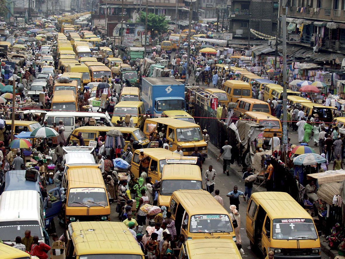VIEW FROM ABOVE OF A TPICAL DAY AT A LAGOS BUSTOP