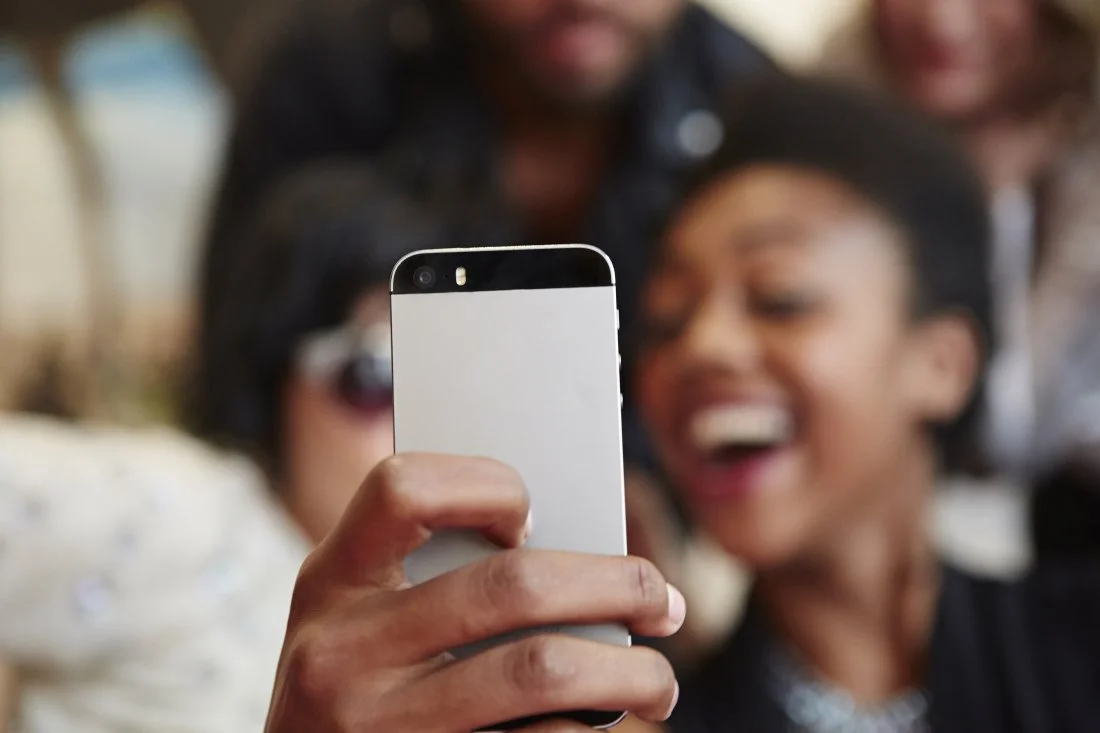 Lady making Snapchat stories via gettyimages 