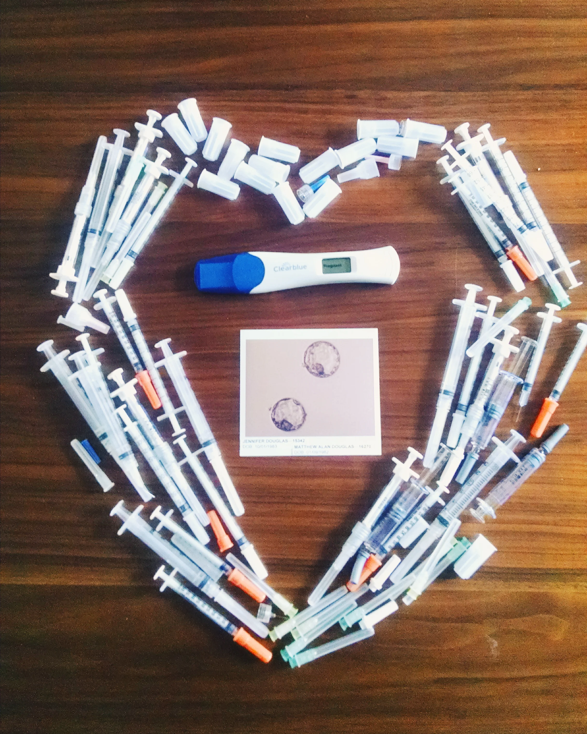 This is a photo of Jen's injection needles, the first picture of the babies from day 5 and the first ever positive pregnancy test! 