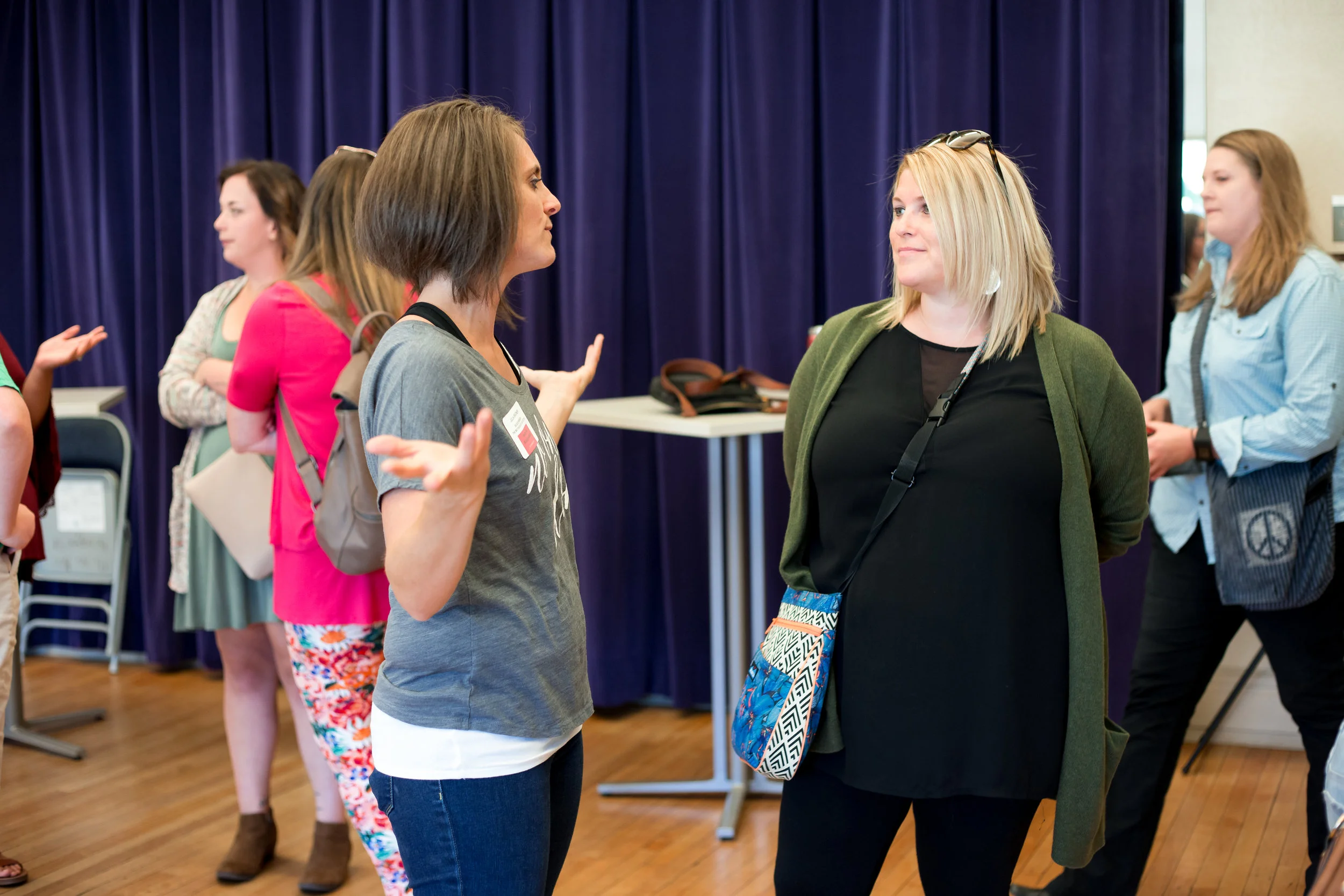 Board Member, Julia Bradner, greets guests.© Christi Stafford Photography