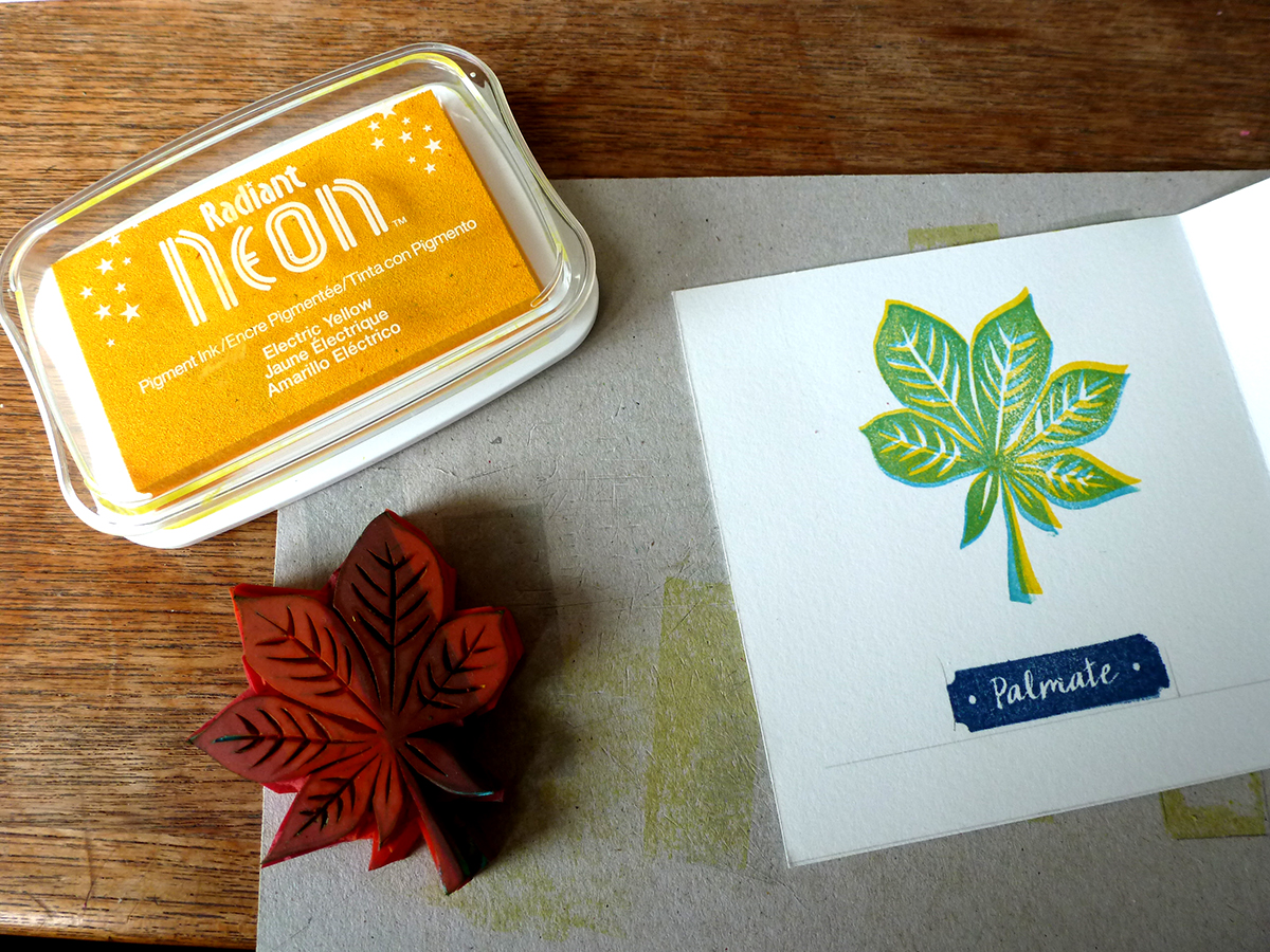 Leaves printed in yellow and blue neon ink, labels printed in midnight blue