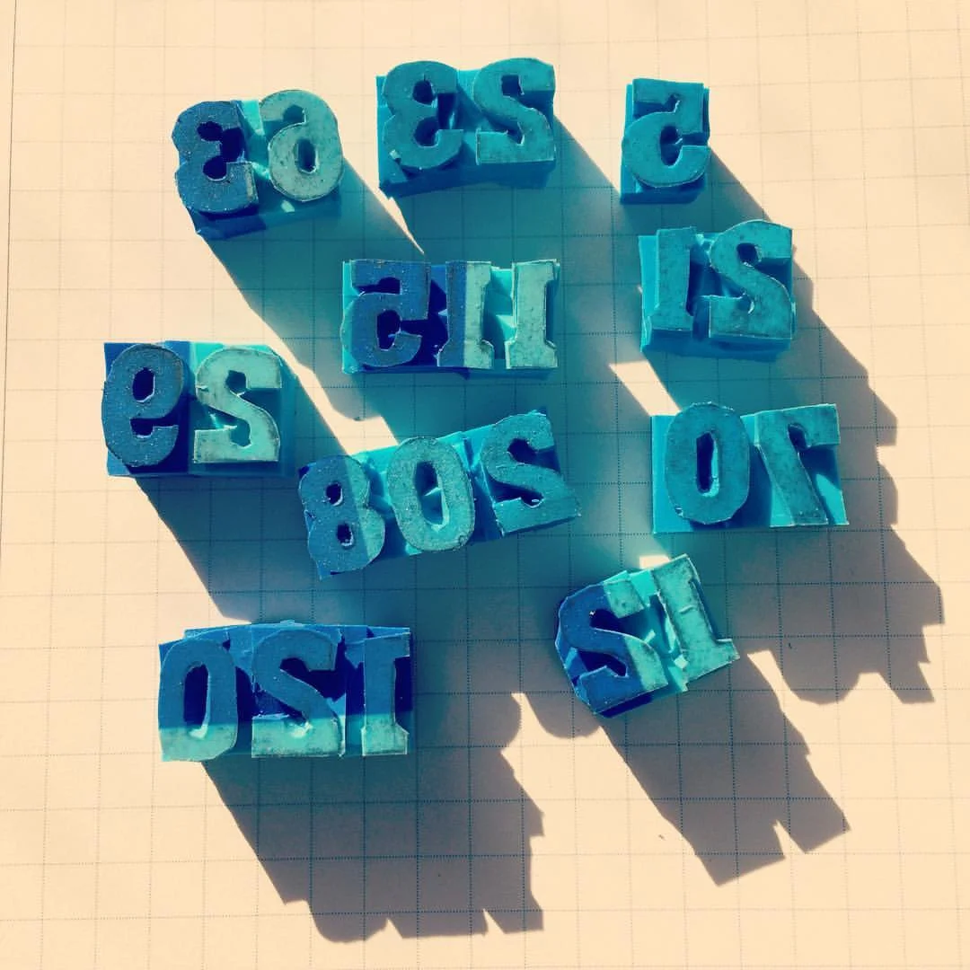 Hand carved rubber stamps for the house numbers