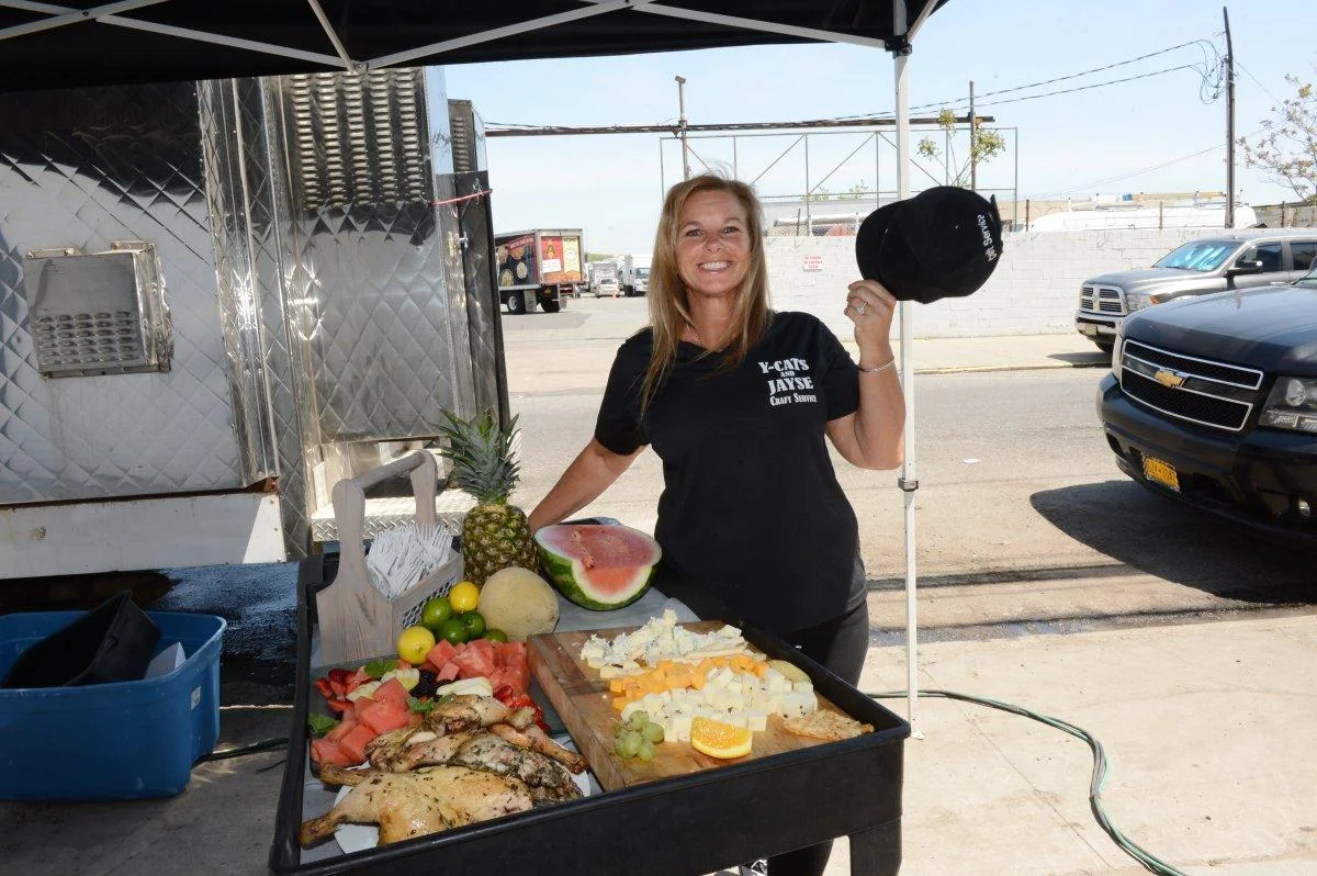 Stacy Adler, owner of Y-Cats Craft Service, arranging lunch on the set of a shoot.(ANDREW SAVULICH/NEW YORK DAILY NEWS)