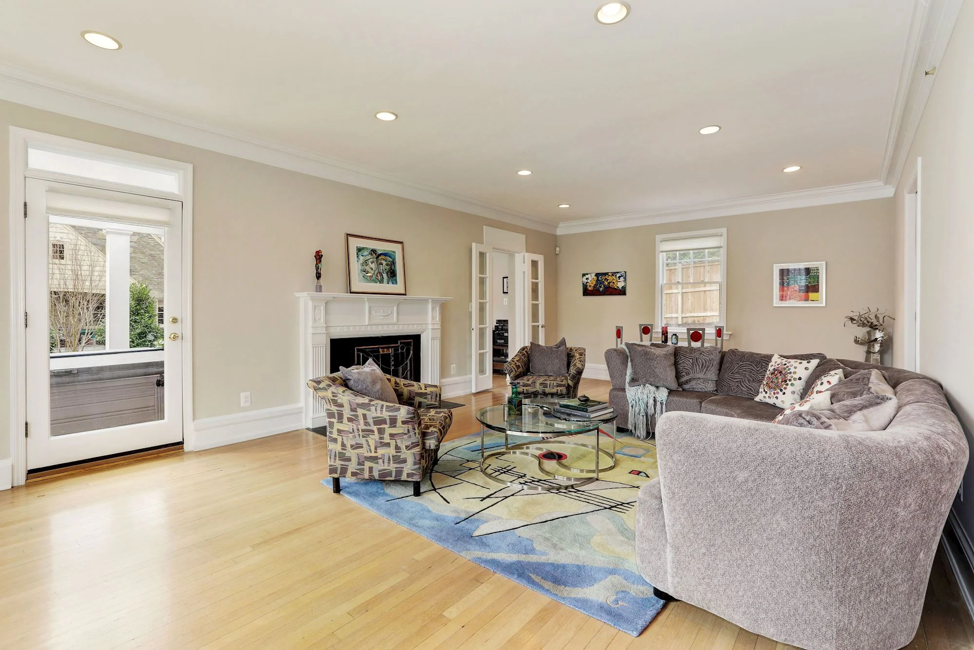 Living Room with gas fireplace open to terrace overlooking park