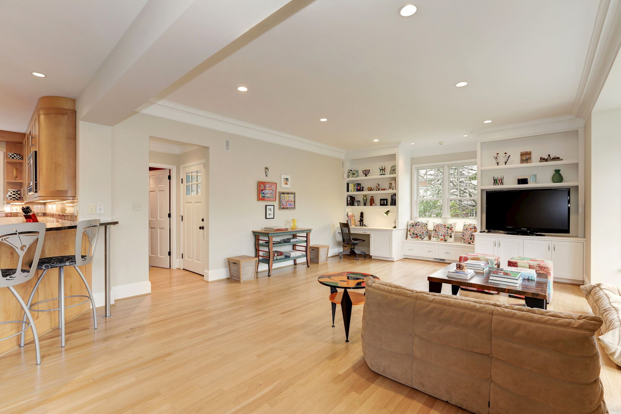 The bright and expansive Family Room opens to screened porch