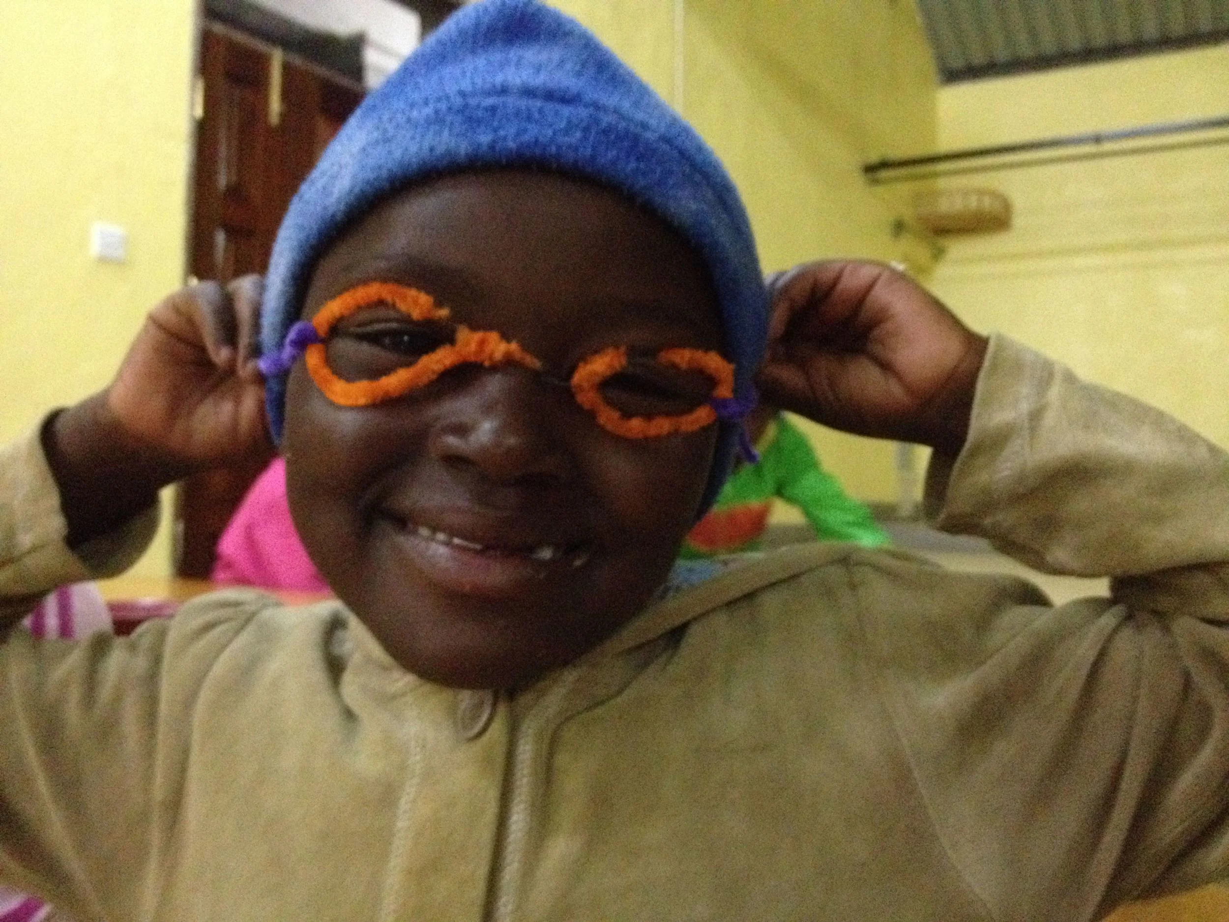 A student shows off her homemade glasses.