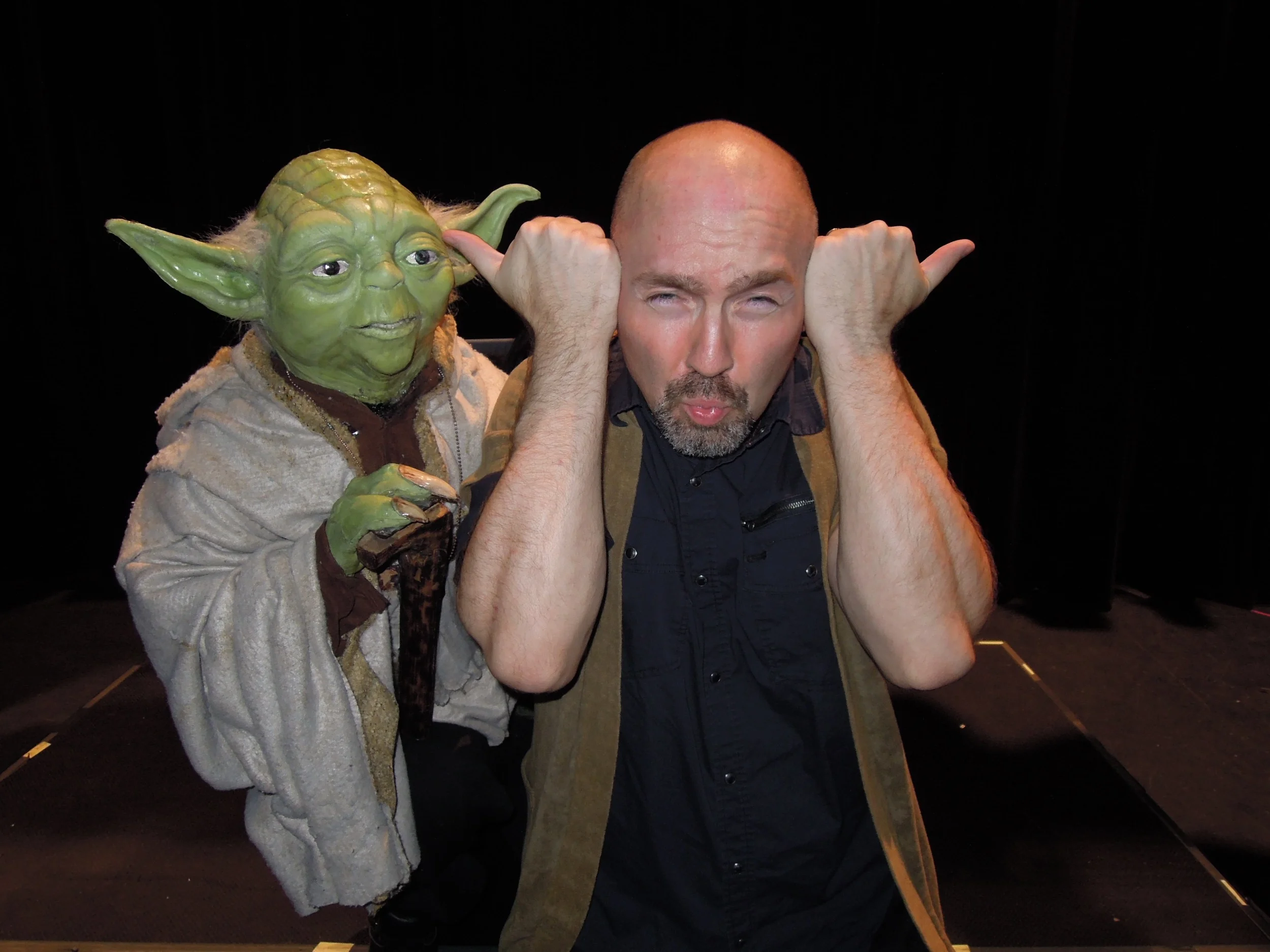One's a weird dude that says incomprehensible things and the other's a puppet.