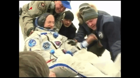 Scott Kelly gives a 'thumbs up' before disembarking 