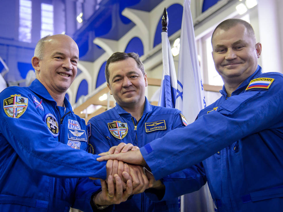 Expedition 47 crew members NASA astronaut Jeff Williams, and cosmonauts Oleg Skripochka and Alexei Ovchinin of the Russian space agency Roscosmos pose for a photograph before their Soyuz qualification exams Wednesday, Feb. 24, 2016, at the Gagarin Cosmonaut Training Center in Star City, Russia. Photo Credit: NASA/Bill Ingalls