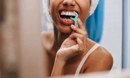Does a Water Flosser Really Clean Better Than String Floss?