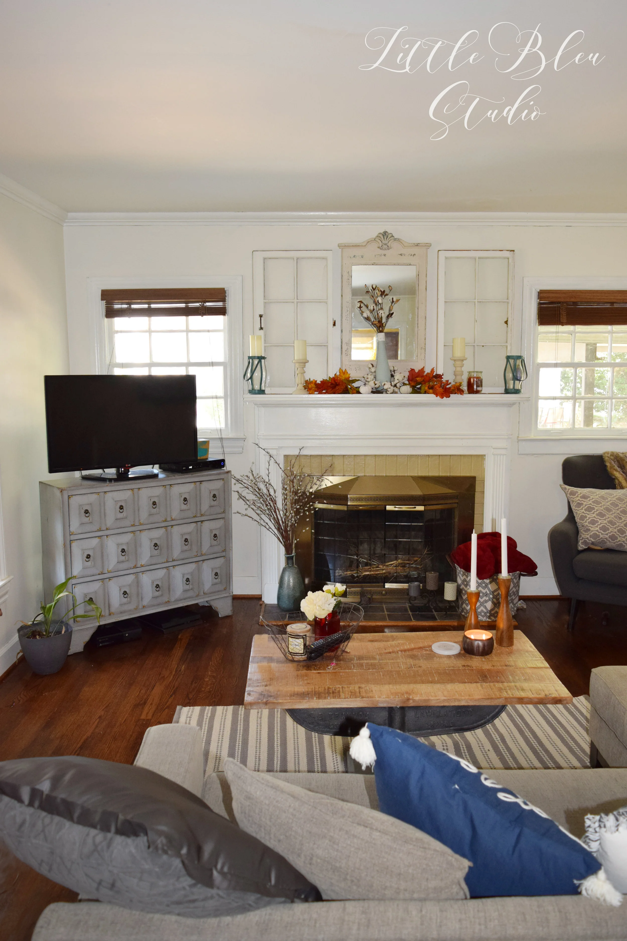 Here's one view of my living room! The floor over by the TV previously had some damage, so thankfully, while they were refinishing these floors, they were able to replace the damaged piece with one of the leftover boards from another room!