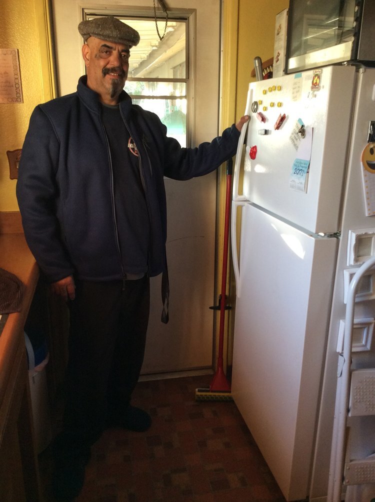 Man with new refrigerator