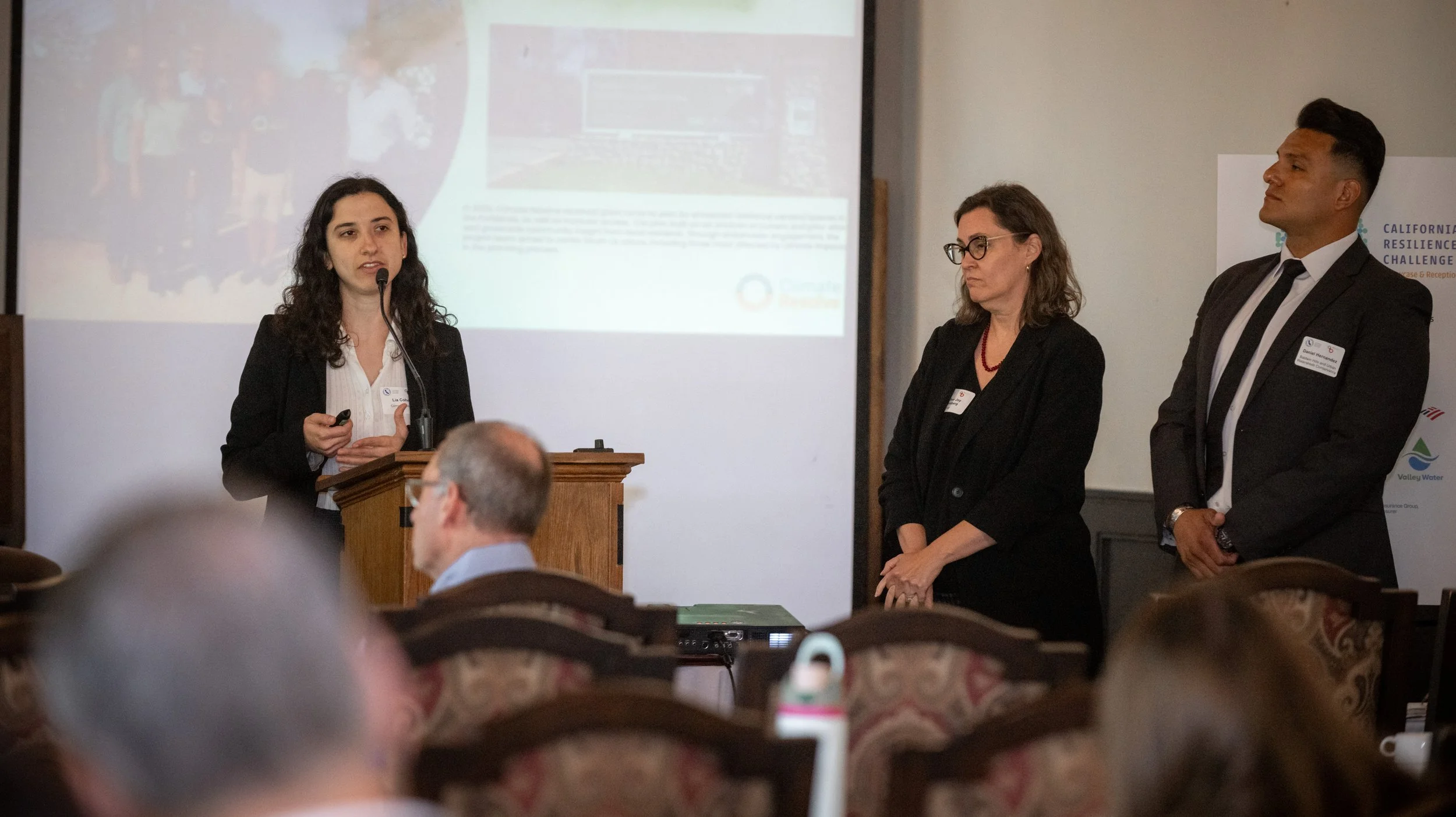 Lia Cohen at podium.jpg