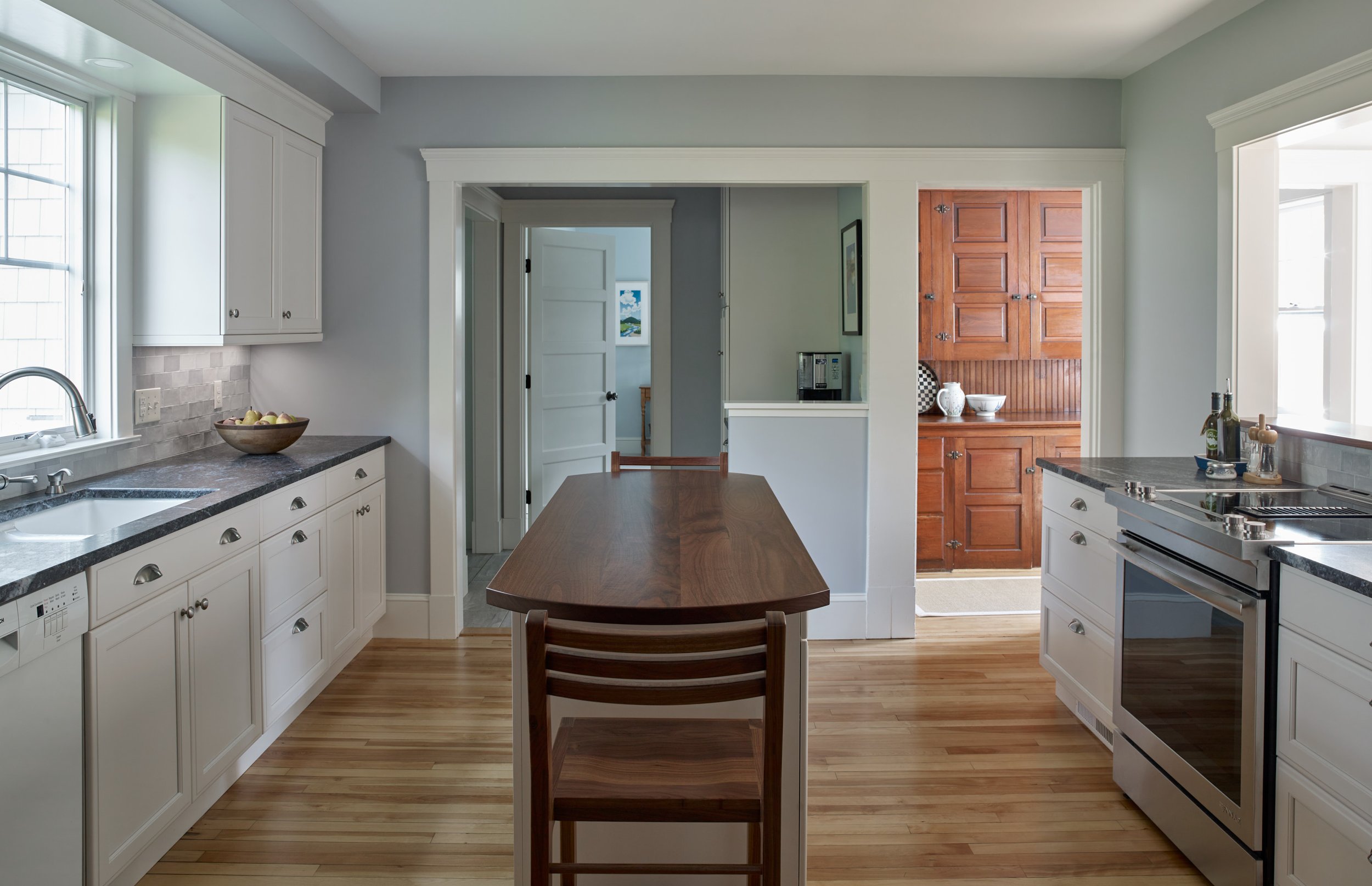  SHINGLE STYLE UPDATE  Kitchen looking through pantry area toward primary bedroom and original butler’s pantry 