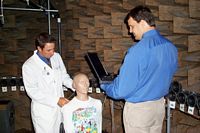 Dr. David Gnewikow and assistant experimenting with dummy 