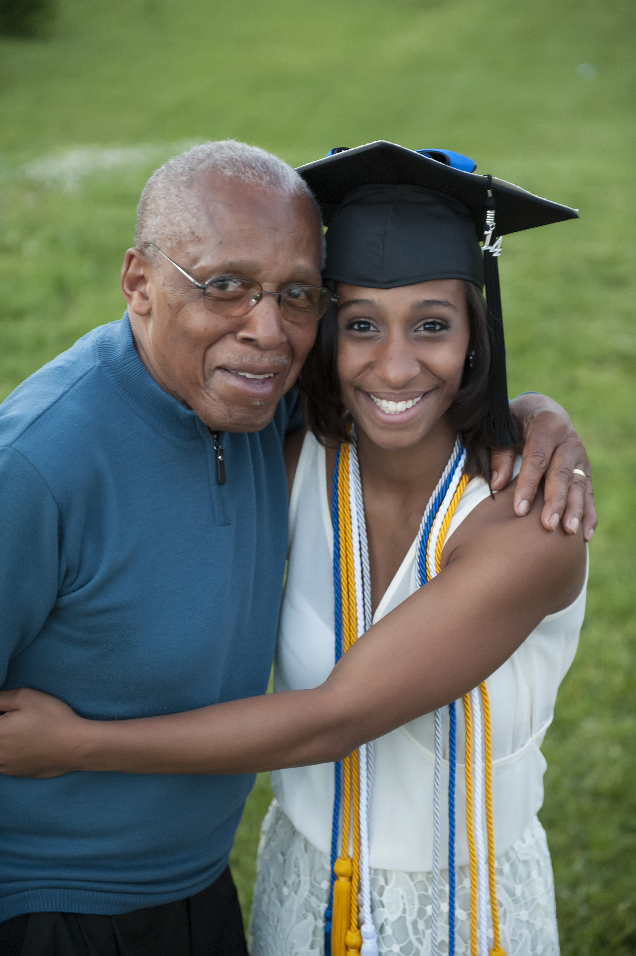 Grandfather enjoying his daughter's graduation.