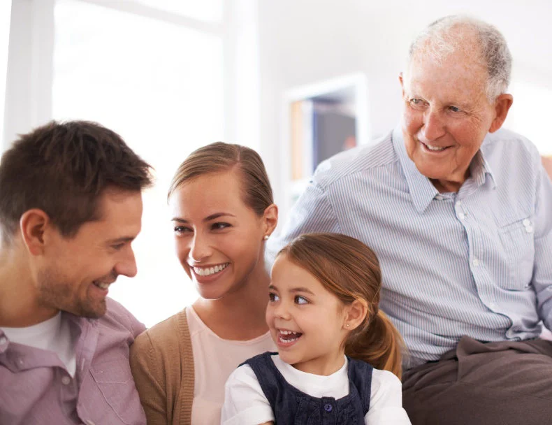 Grandfather enjoying time with his children and grandchildren