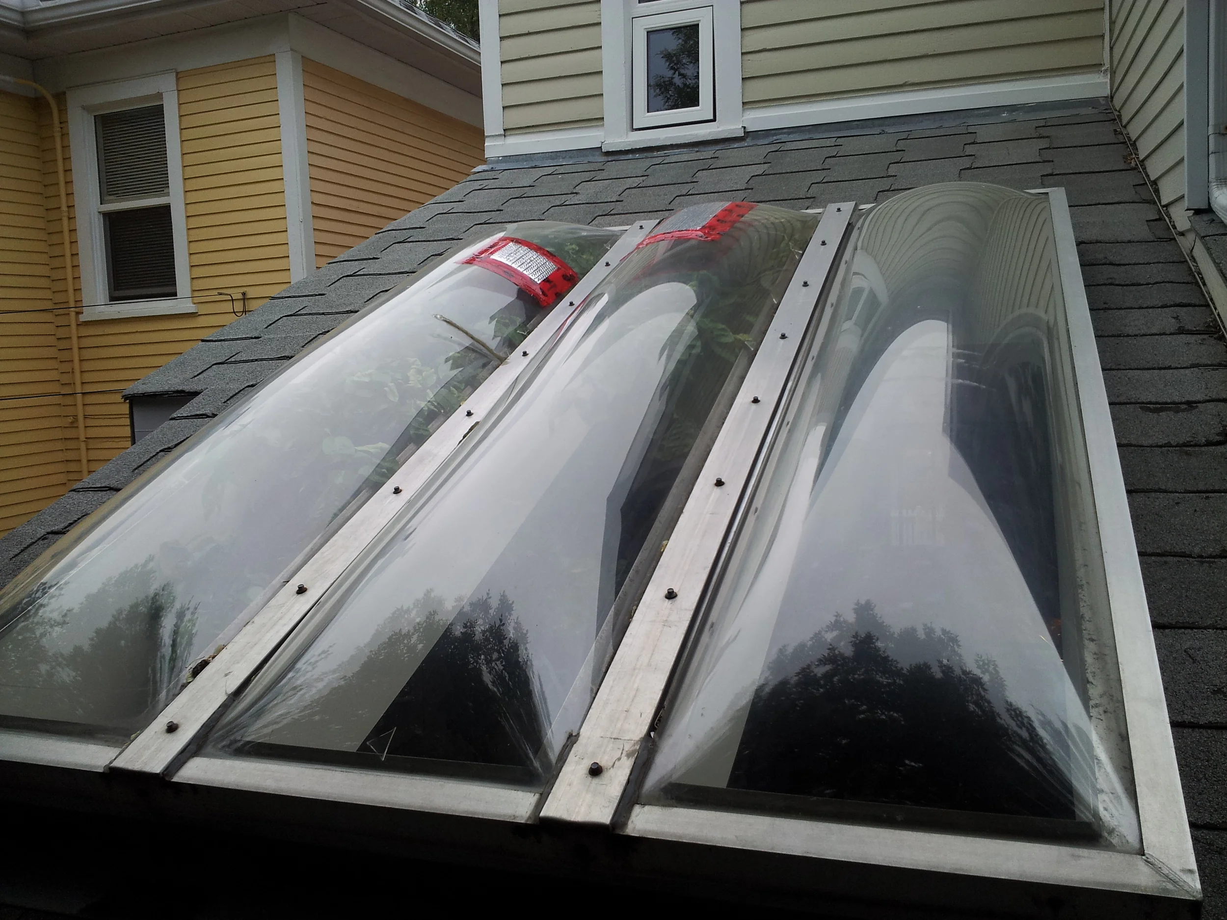  An old tandem skylight being temporarily repaired and measured up for replacement. 