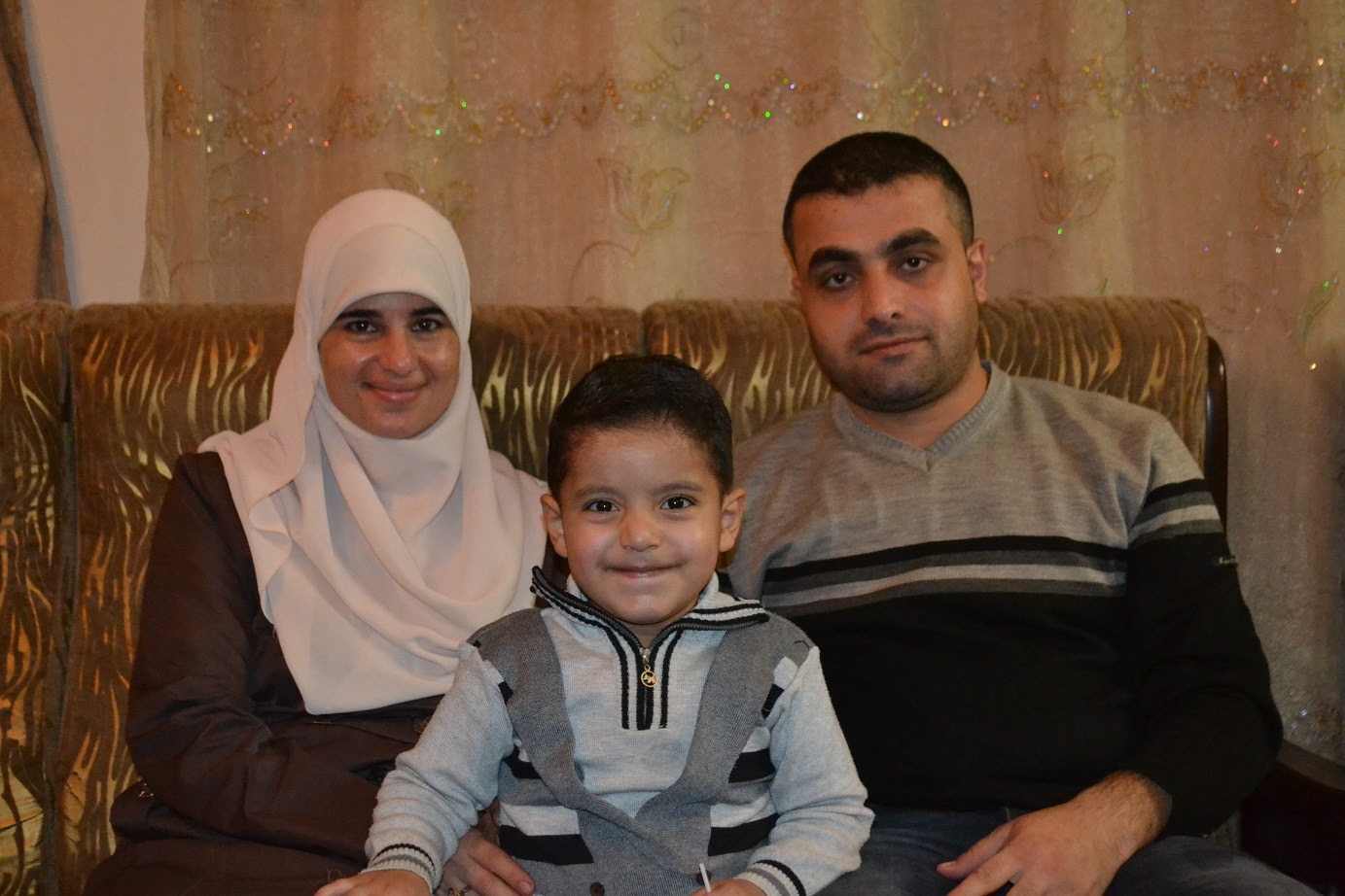 Hedaya and Sharif Sammur with their 3-year-old Zain. Hedaya was questioned by Israel's Security Agency when she tried to take Zain for treatment inside Israel.