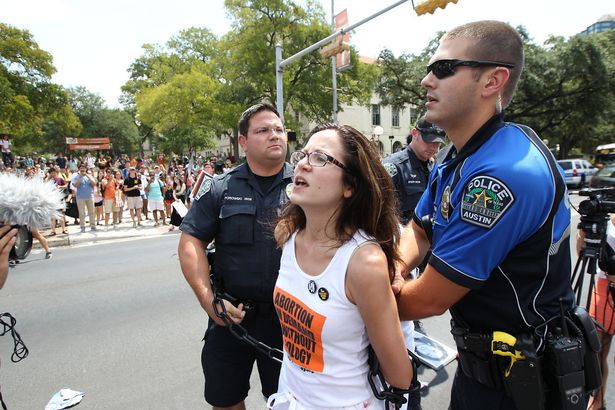 Sunsara Taylor arrested while protesting the anti-abortion law, HB2, in Texas