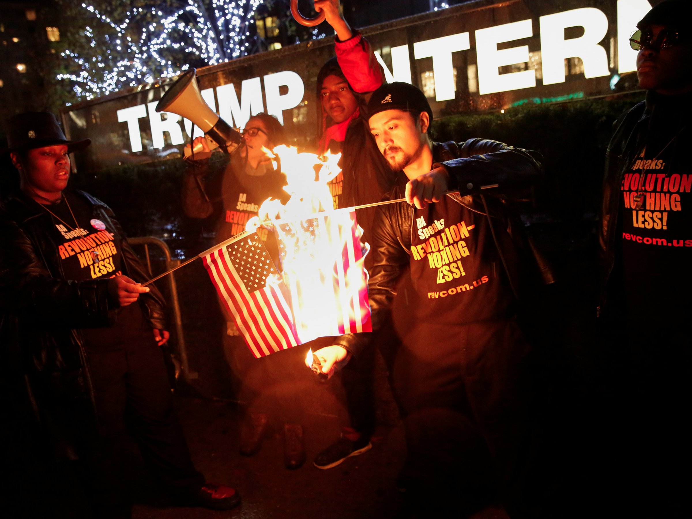Activists burn the US flag in front of Trump Tower in New York City