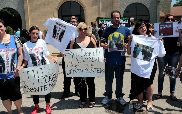 Family members and others protesting roundups in Metro Detroit