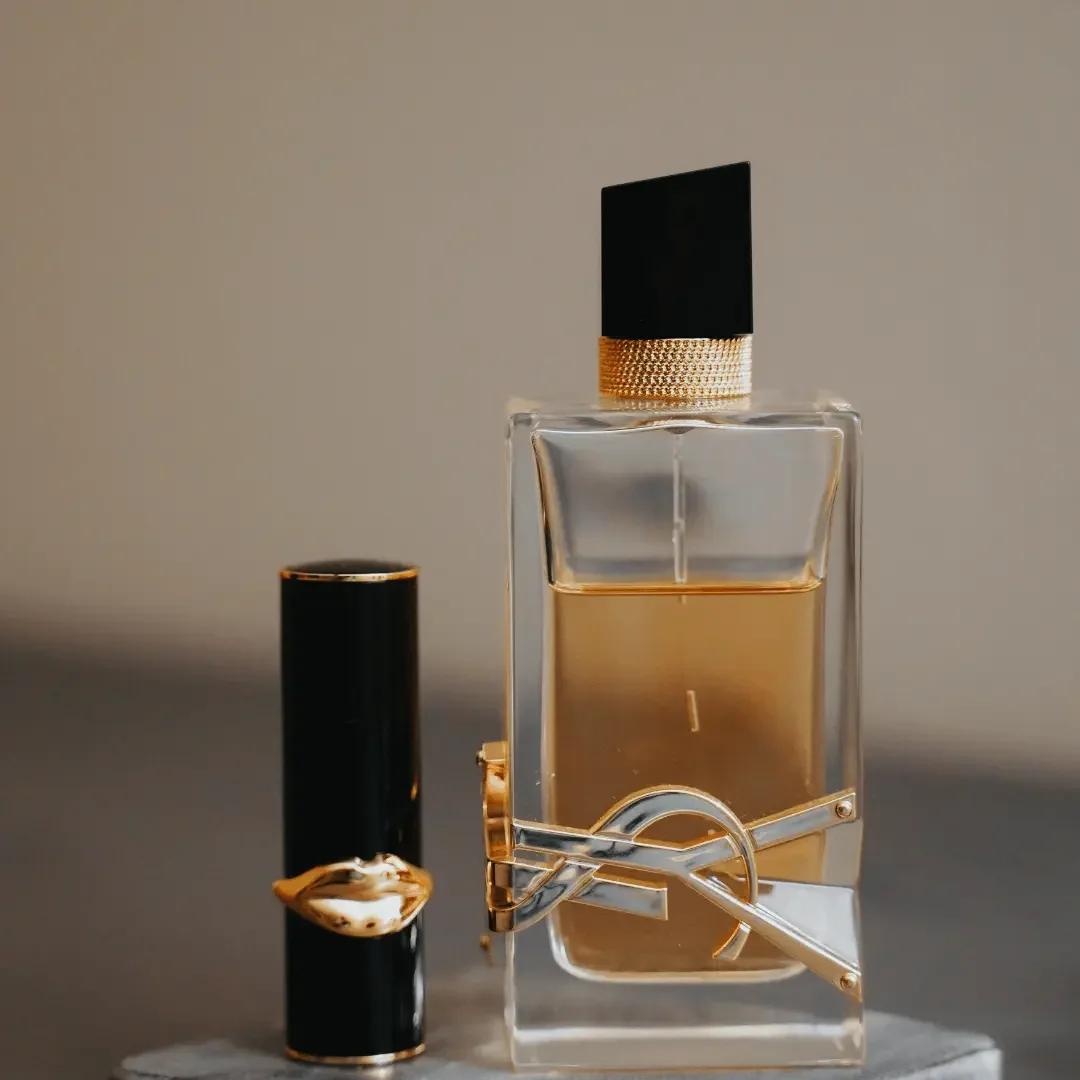 intentional brand strategy female entrepreneur . ysl Perfume bottle
