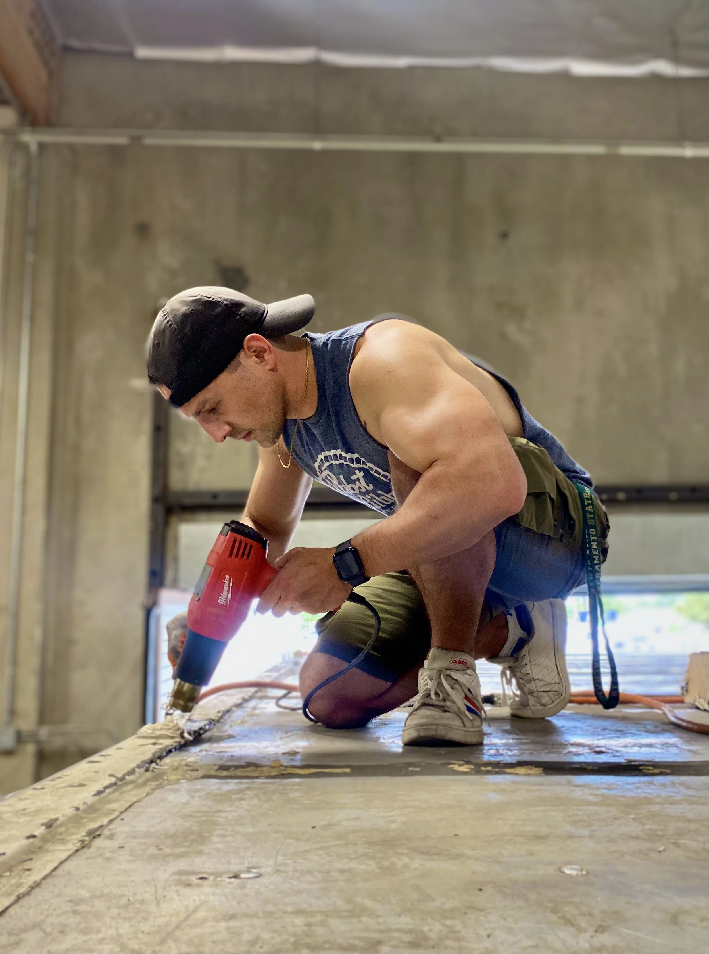Removing inferior roofing materials for a roof re-seal