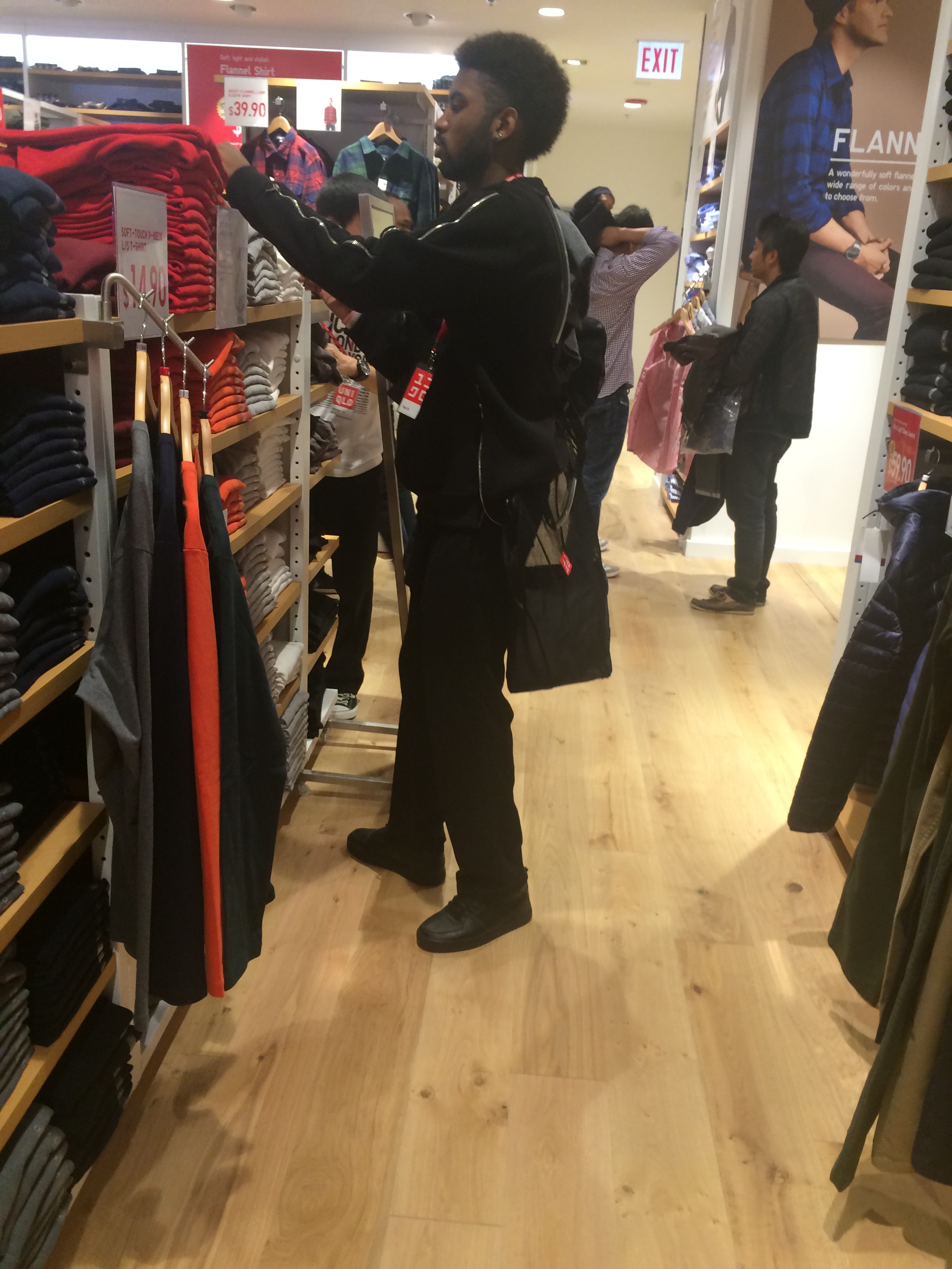 Staff carry two shopping bags and Sorting clothes.JPG