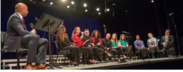 Dr. Derrick Gay moderates a panel discussion among student musicians from the Young People's Chorus of New York, Chicago Children's Chorus and the YMCA Jerusalem Youth Chorus.