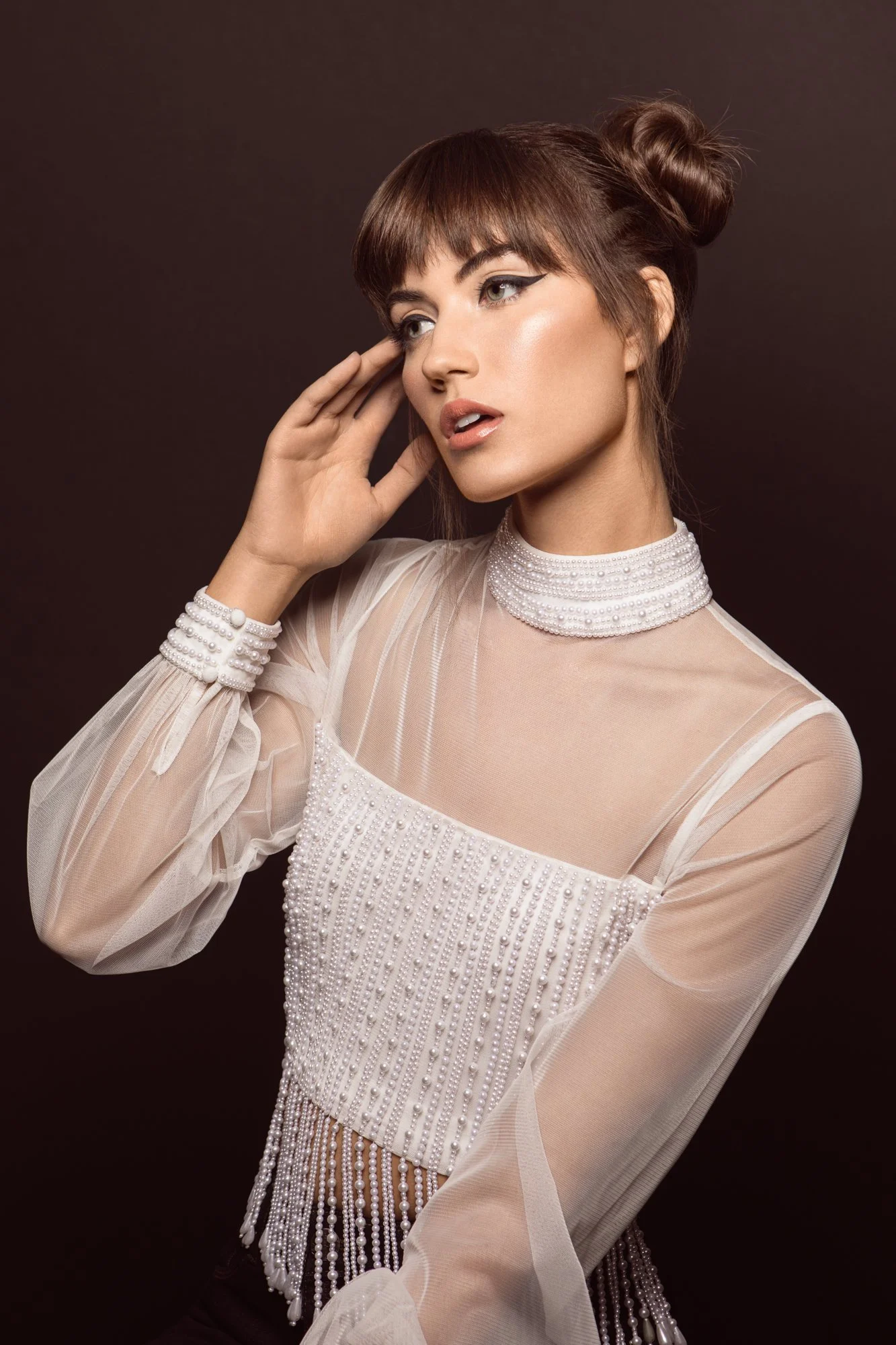 Pittsburgh model closeup portrait on black background wearing white pearl top