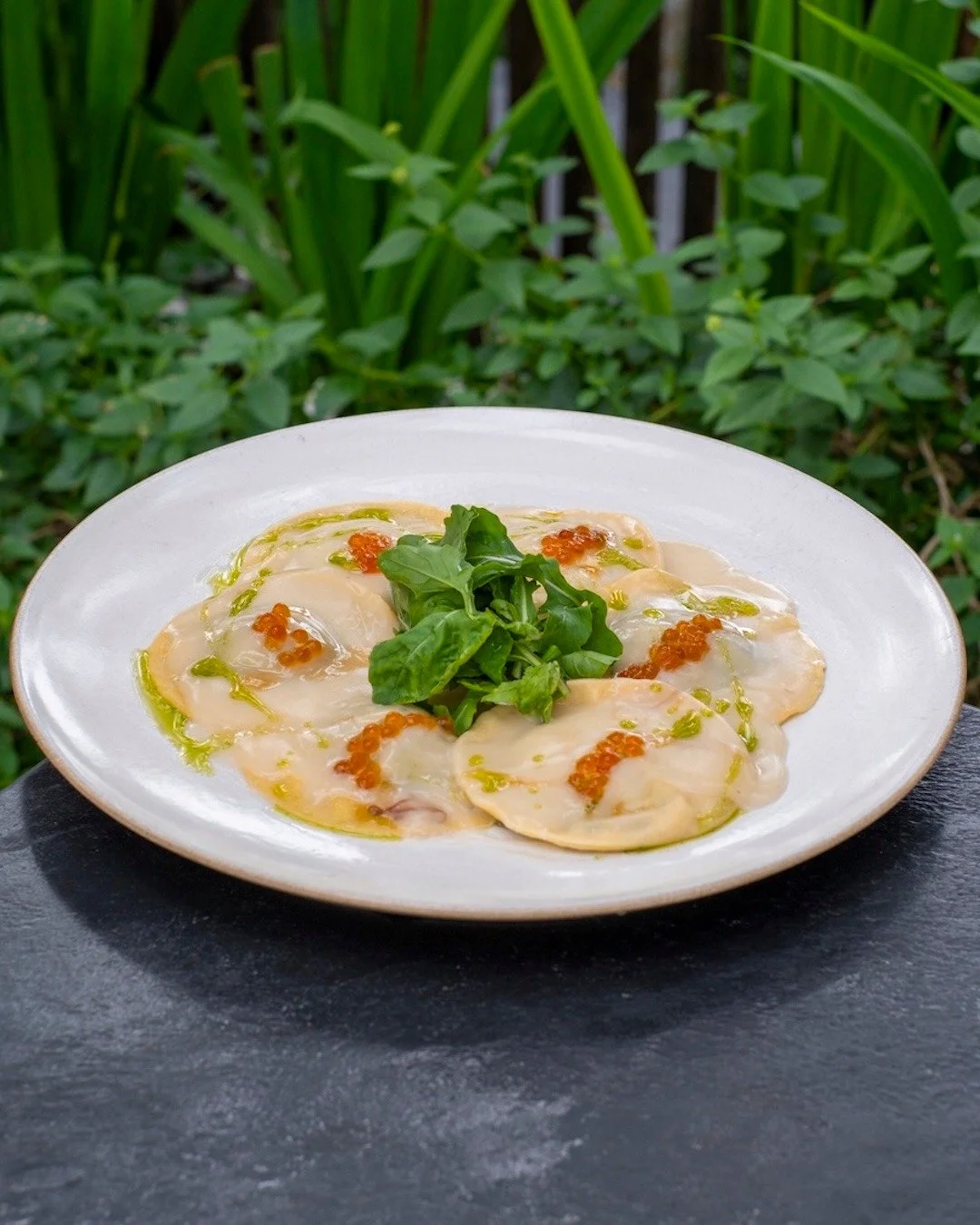 Soft, savory, and oh-so-satisfying &mdash; ravioli kissed with katsuo velout&eacute; and a pop of salmon roe. The kind of dish that feels like sunset on a plate. 🌿🥂 #UbudEats #APerfectBite

RAVIOLI
spinach &amp; mushroom puree, salmon roe, rucola, 