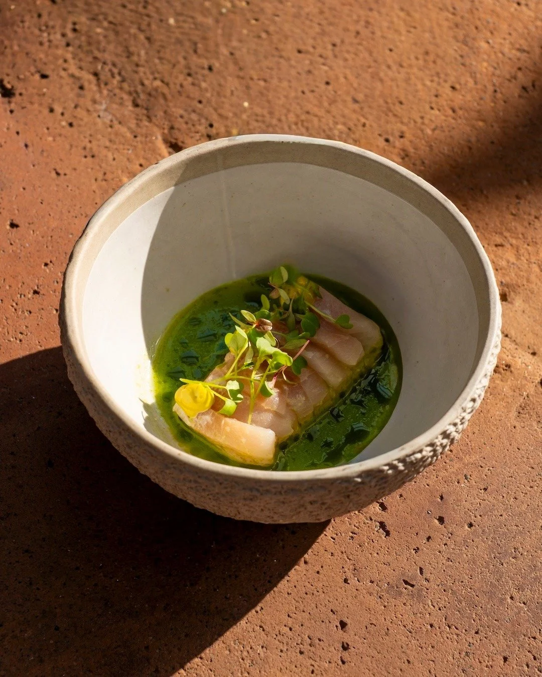 Fresh, bright, and beautifully balanced.
Our Snapper Ceviche lands on the table with salsa verde, basil emulsion, and a crisp baby greens salad &mdash; a starter designed to wake up the palate and set the tone for dinner above the rooftops. ✨🌿 #Ubud