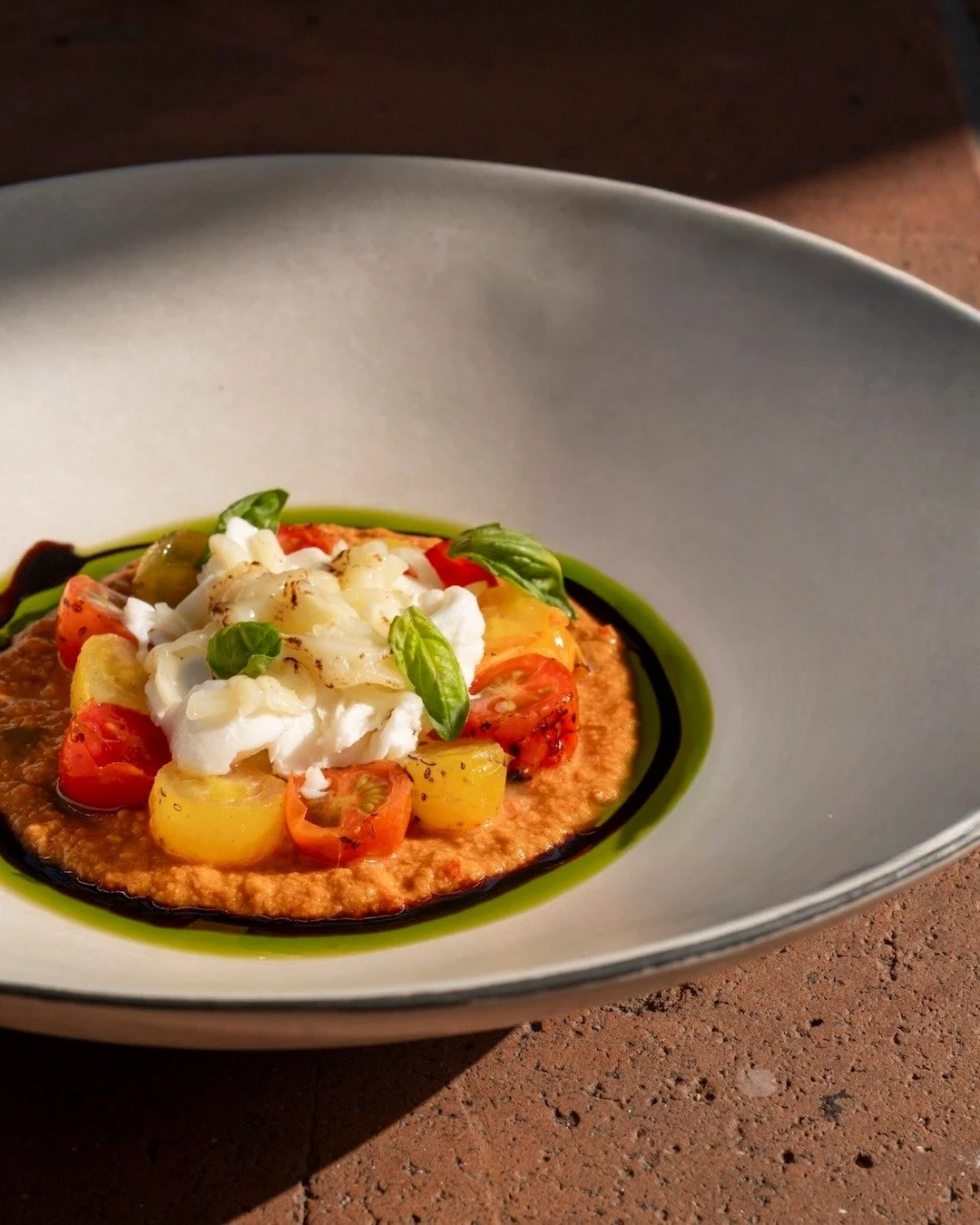 Creamy, bright, and sweet in all the right places.
Our Caprese Salad drapes bocconcini and organic tomatoes &mdash; a classic that always feels new. ✨🍅 #UbudEats #APerfectBite

CAPRESE SALAD
bocconcini, organic tomato, basil, balsamic glaze
+ d i n 